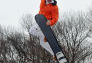 A talented snowboarder in the air