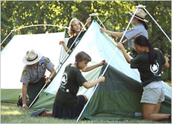 Rangers and kids in front of tents