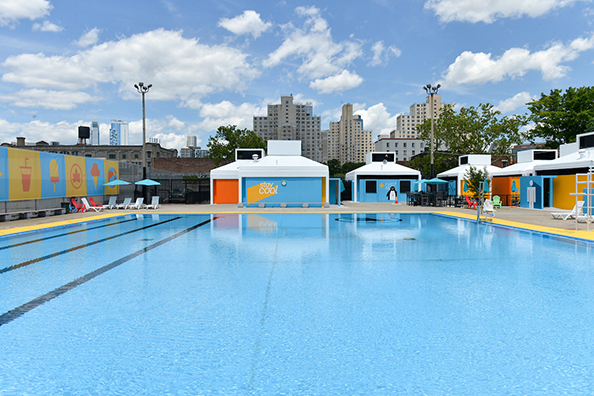 The locker rooms and first aid areas at Douglas and DeGraw Pool feature penguin decals, vibrantly-colored blue, orange, and yellow paint on the walls, and signs that read first aid and stay cool.