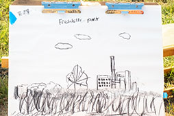 a drawing of a building, lawn, trees, and clouds at Freshkills Park