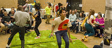 the cast performs in front of an audience at a center