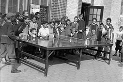 archival black and white image of children playing ping pong at Marcus Garvey Park