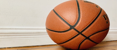 A basketball on a floor in a house