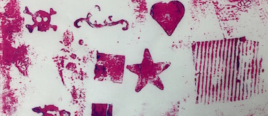 This artwork is Collagraph Print on Rice Paper. The image of the artwork includes symbols in pink of hearts, starts, crowns, puzzle pieces, a skull, grate, and more stamped, some smudged, and on paper.