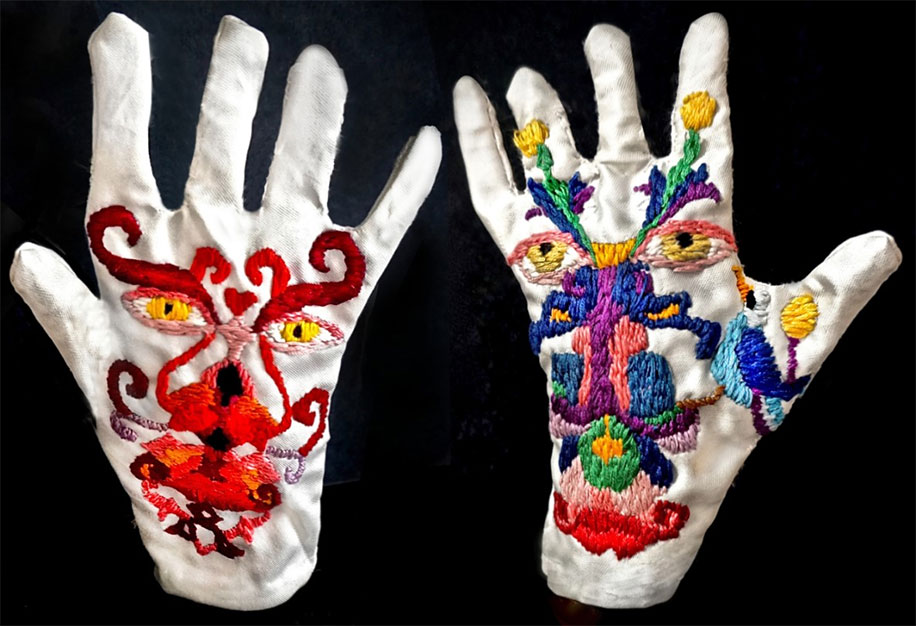 Face made of parts of plants and flowers are embroidered on white gloves