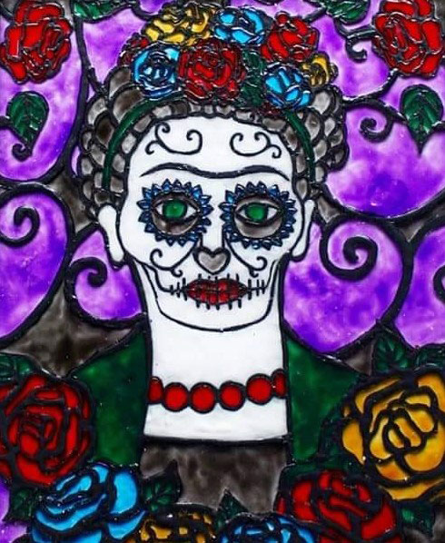 Image of a calavera-like painting of artist Frida Kahlo with flowers in her hair as she stands against a purple ornate background