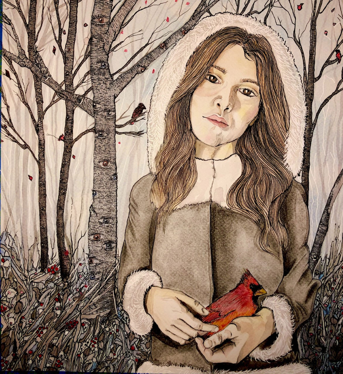 A girl leans her head to the side while standing in the wintry woods and holding a red cardinal