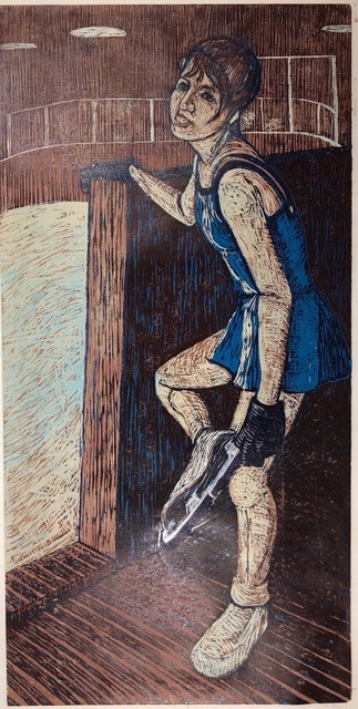 A dancer puts on her ice skates