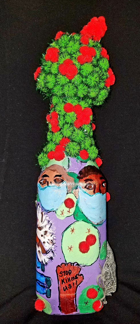 Image of a bottle with the the microscopic view of the virus on top of the bottle. Scenes drawn on the bottle include folks wearing masks and writings on a Black fist that reads Stop Killing Us.
