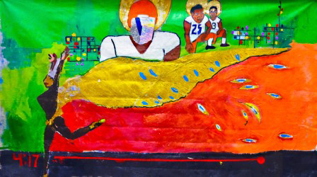 Players in white uniforms, two with the numbers 25 and 3, kneel alongside a landscape. A dancer moves across the space with a golden train as part of their clothing above a red space. The time 4:17 is written in the corner.
