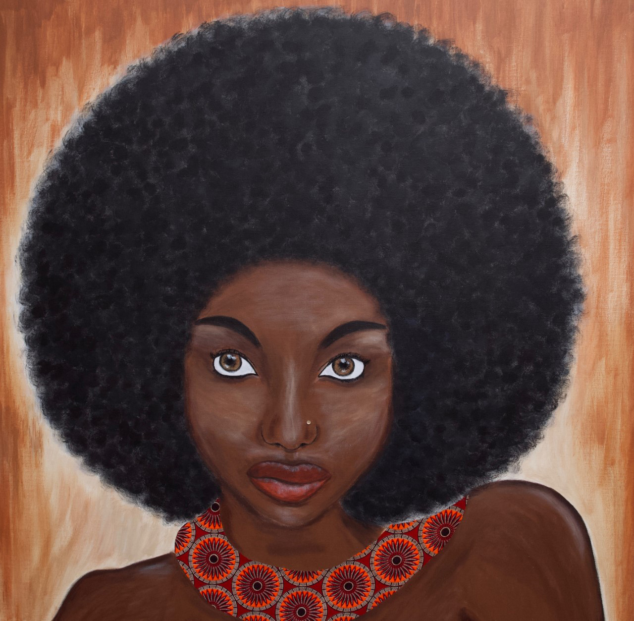 portrait of a woman with an afro wearing a traditional necklace