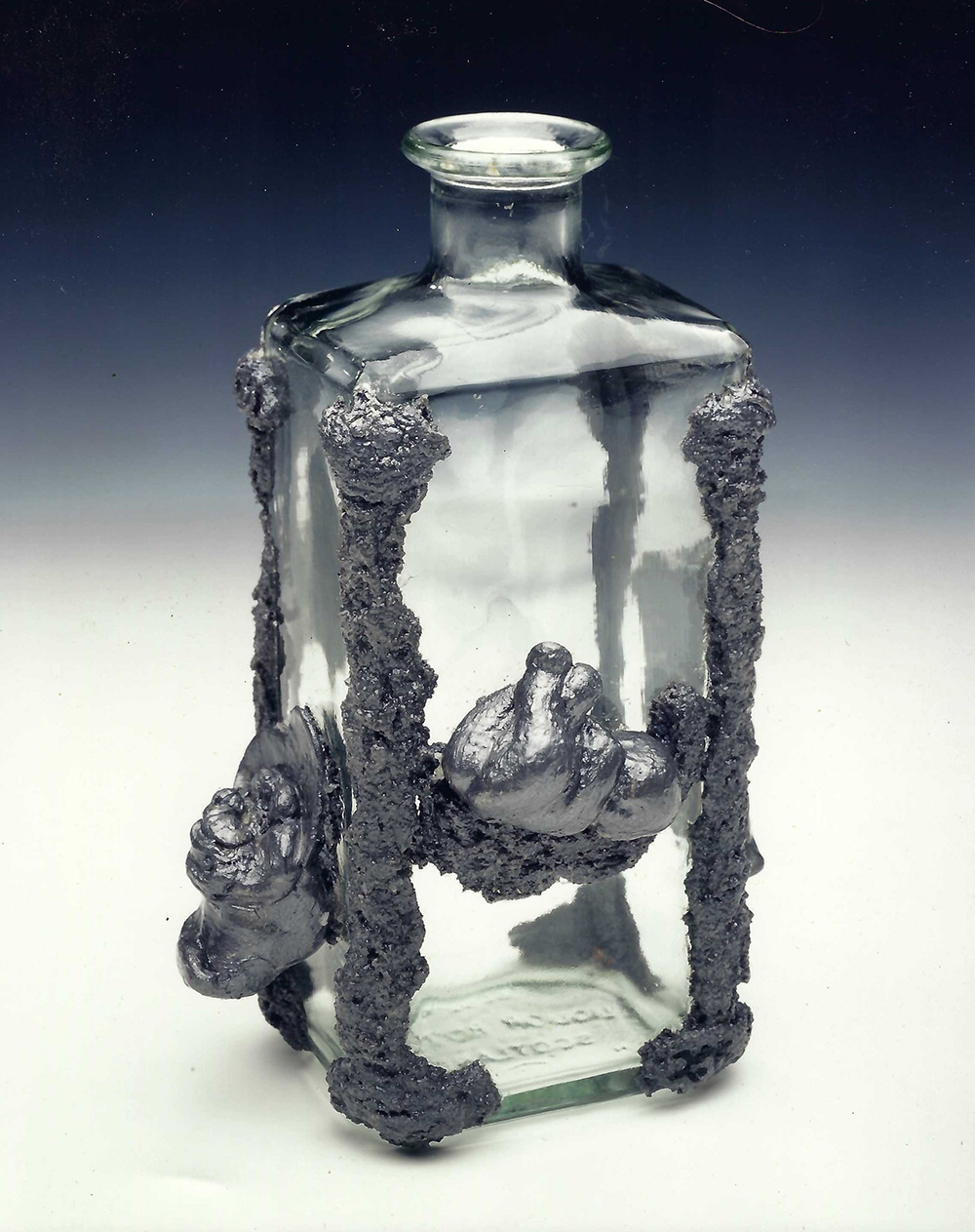 silver forms on the outside of a glass bottle