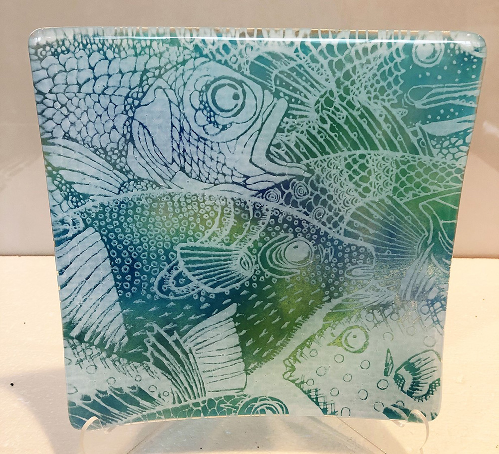 patterns of fish in green, blue, and purple