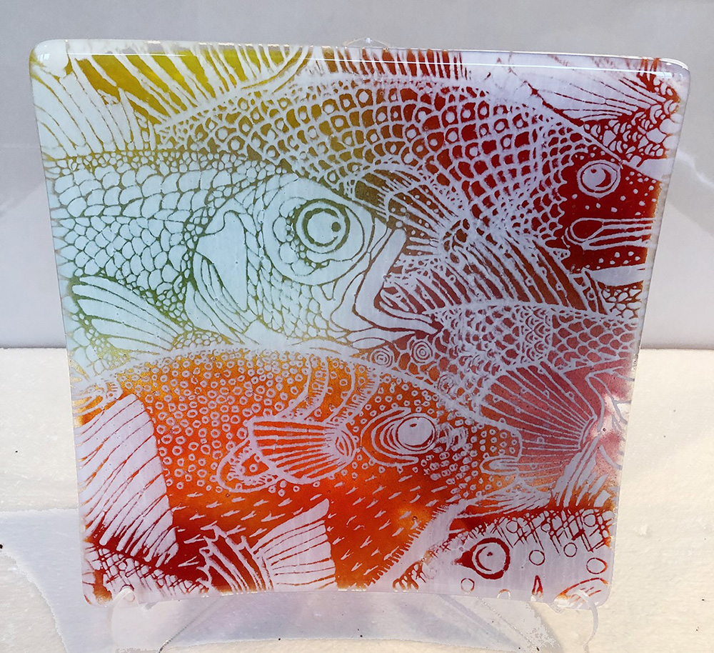 patterns of fish in green, yellow, red, and orange