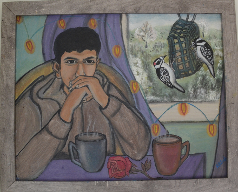 a man thinks deeply with his hands clasp to his mouth over two cups of coffee as birds eat from a birdhouse by the window