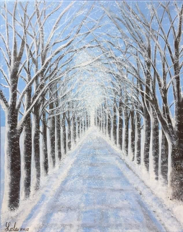 an allee of trees in winter without leaves and covered in snow