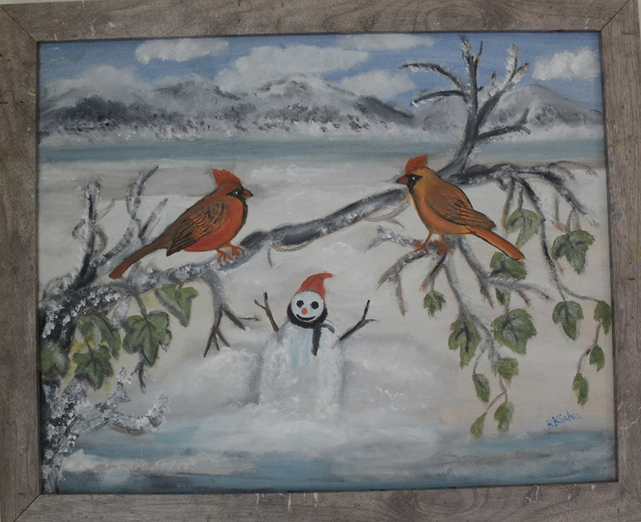 painting of two red cardinals on a branch that looks out to a snowman in snowy landscape near a like with mountains in the backdrop