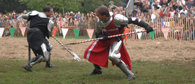 men dressed as knights compete in a jousting contest