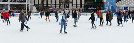 guests ice skate at a rink the park