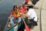 An Urban Park Ranger assists children eager to canoe the restored lake