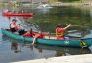 Children test the temperature of the restored lake